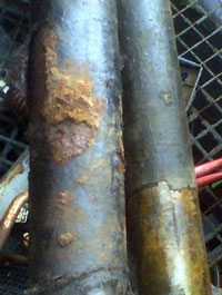 Two steel cylinders that have corrosion