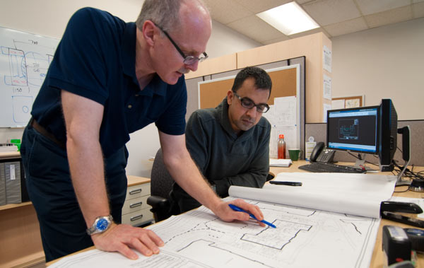 Engineers reviewing drawings - copyrighted