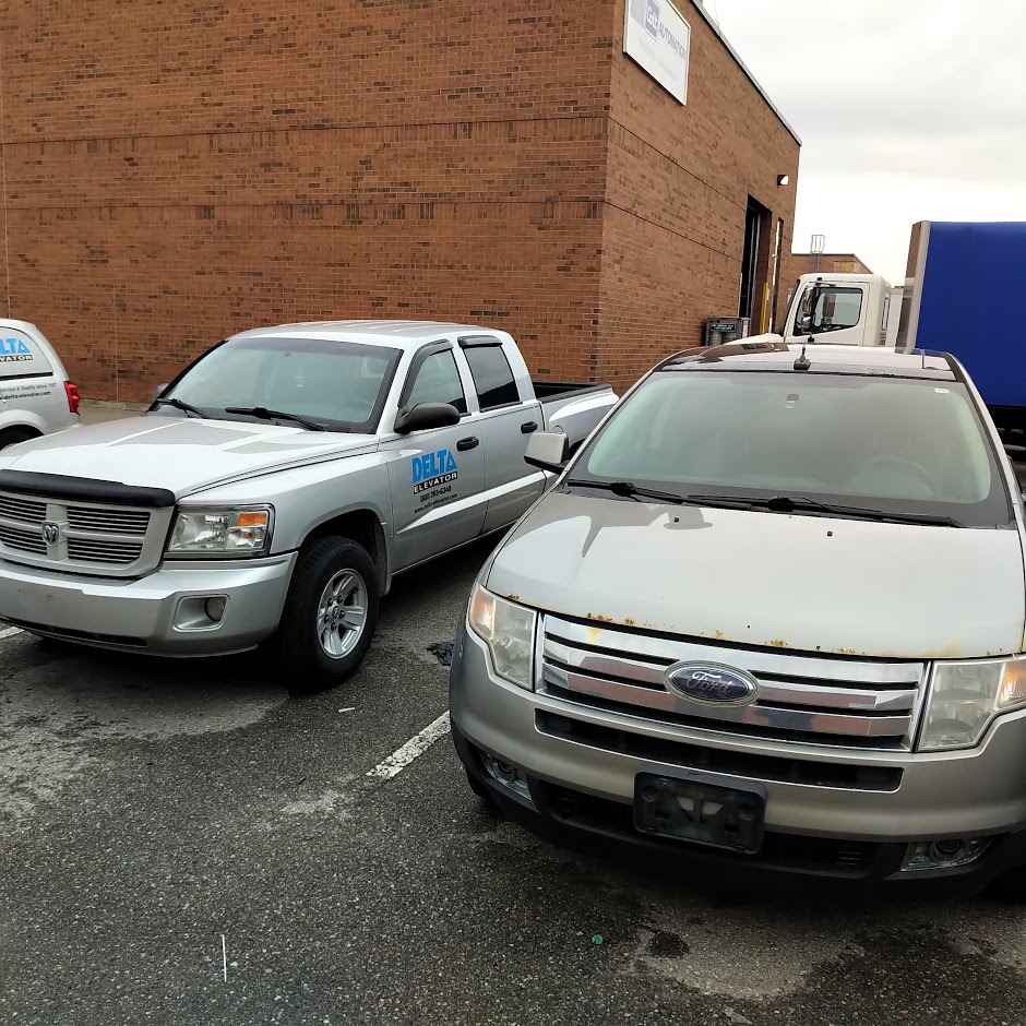 Two parked silver/grey truckes